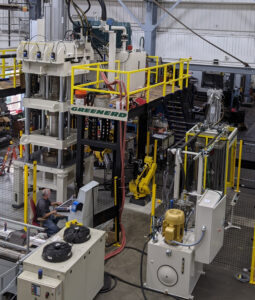 Innovative Hydraulic Press Solutions Include Automation Custom Applications, Greenerd Press & Machine Co., hydraulic press, unique hydraulic press applications, automated two-press, two-robot production cell, built and turnkey-installed, large aluminum pressure vessels, FANUC robot, automated manufacturing equipment, Tier 1 Industrial Authorized Robot System Integrator